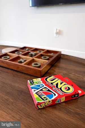 a view of a room with wooden floor and pool table