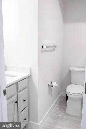 a bathroom with a toilet and a sink