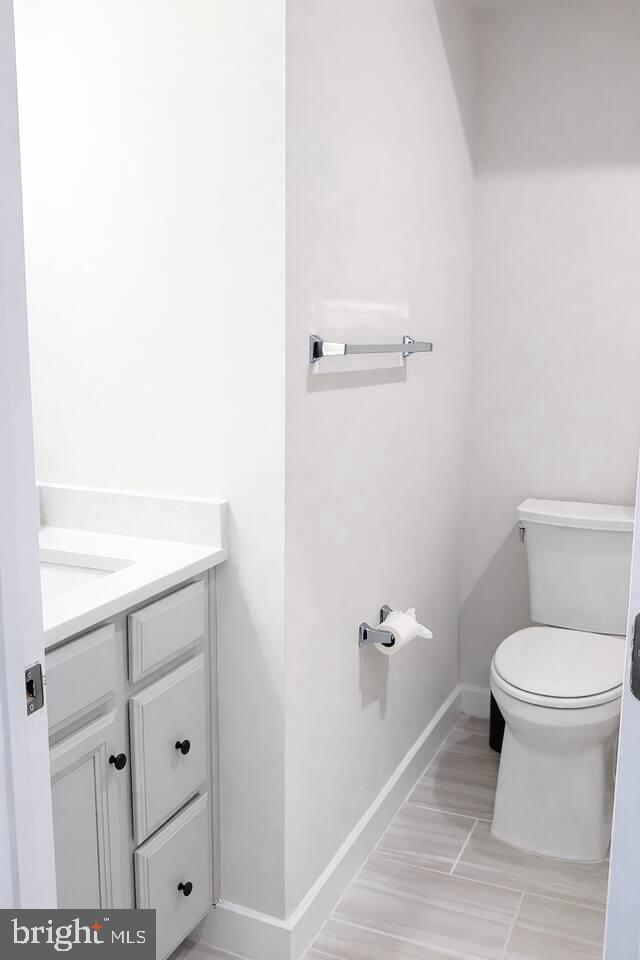 5611 Alpha Ridge Avenue Hyattsville, MD 20782 - Photo 16 of 18 a bathroom with a toilet and a sink