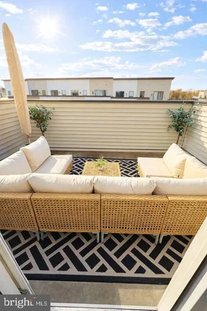 a view of a roof deck with patio