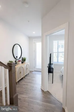 a living room with furniture a window and a table