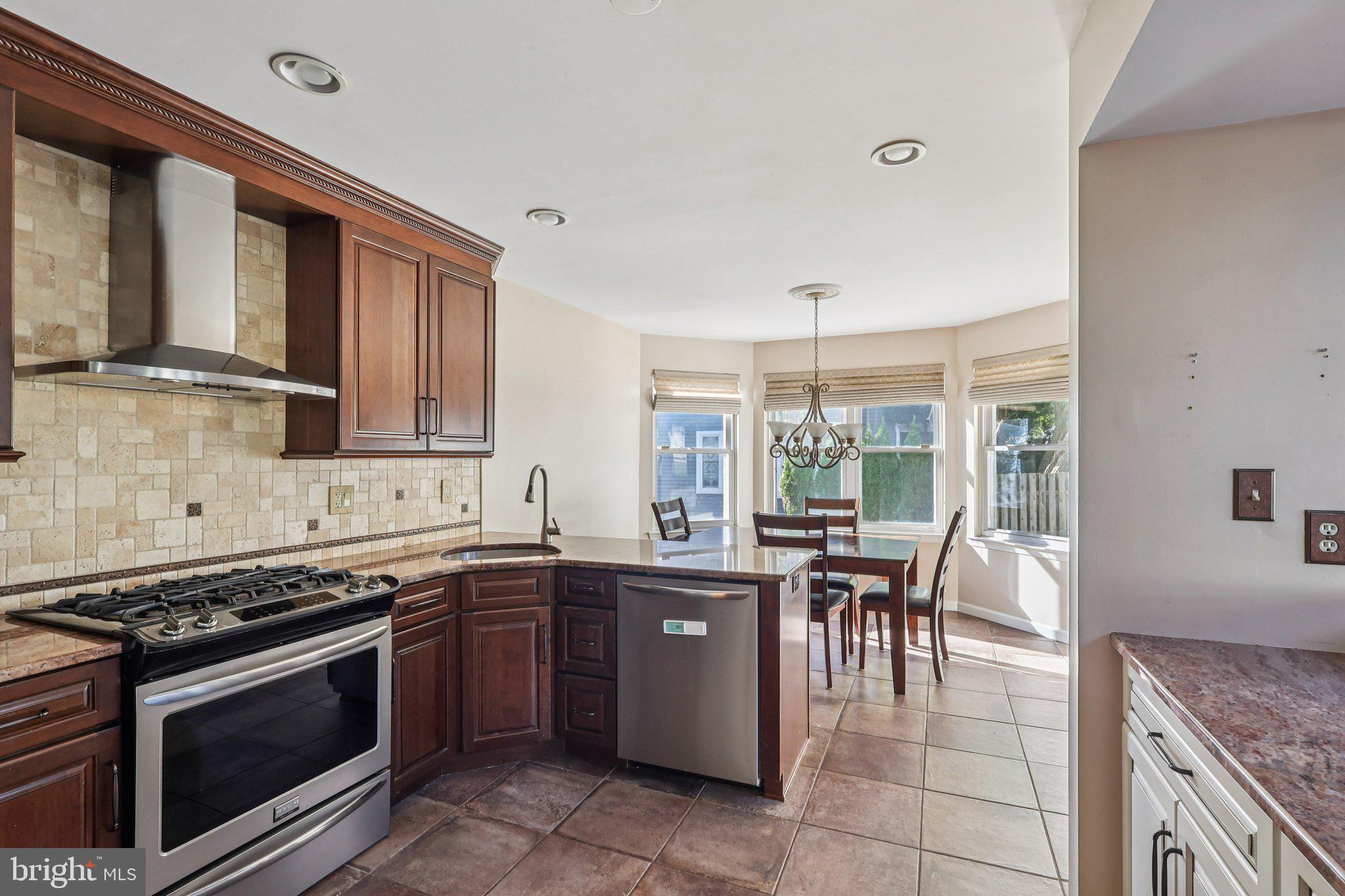 22 Hawk Lane Marlton, NJ 08053 - Photo 21 of 46 a kitchen with a stove sink and cabinets