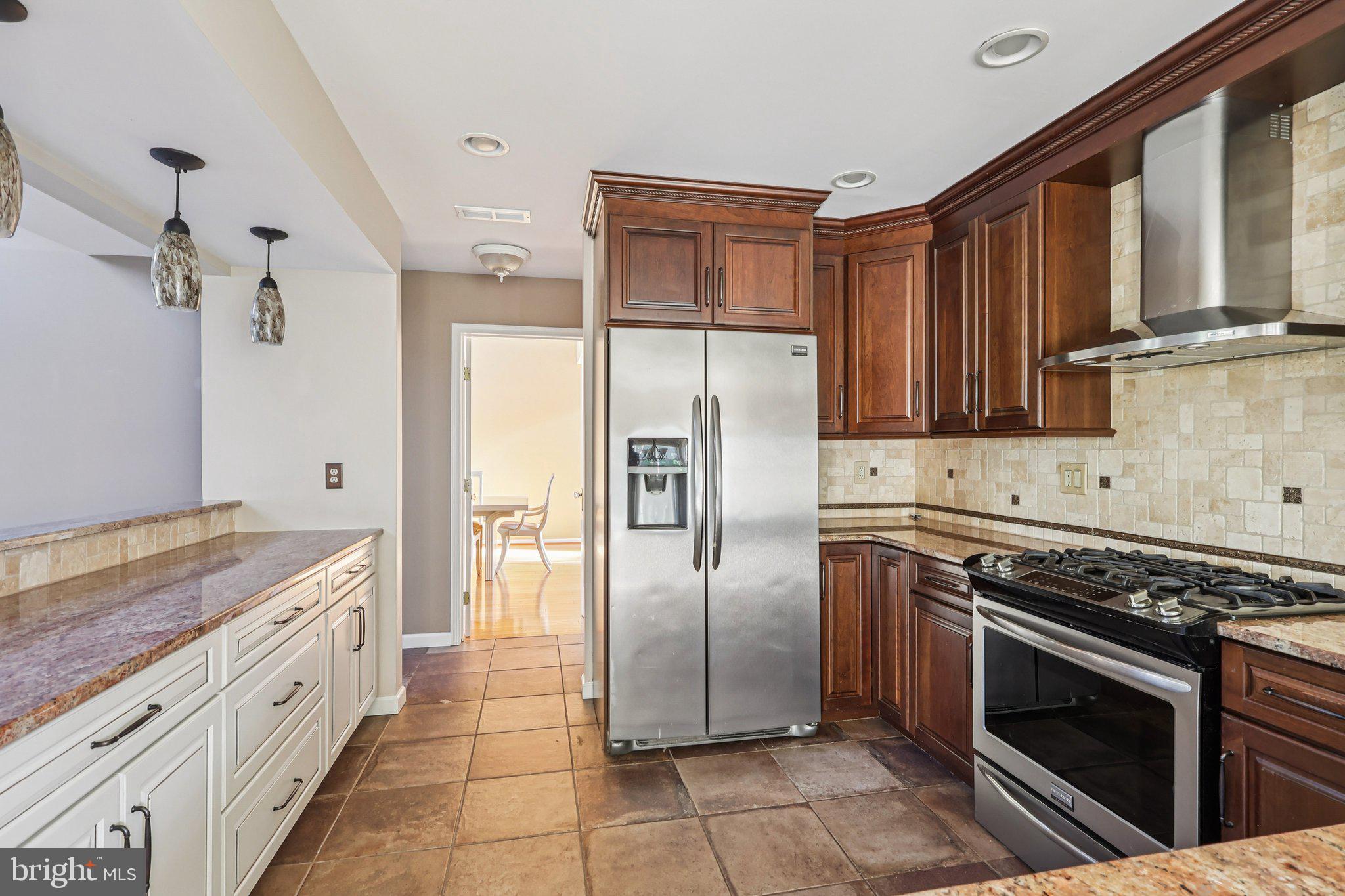 22 Hawk Lane Marlton, NJ 08053 - Photo 24 of 46 a kitchen with stainless steel appliances granite countertop a stove a refrigerator and a sink