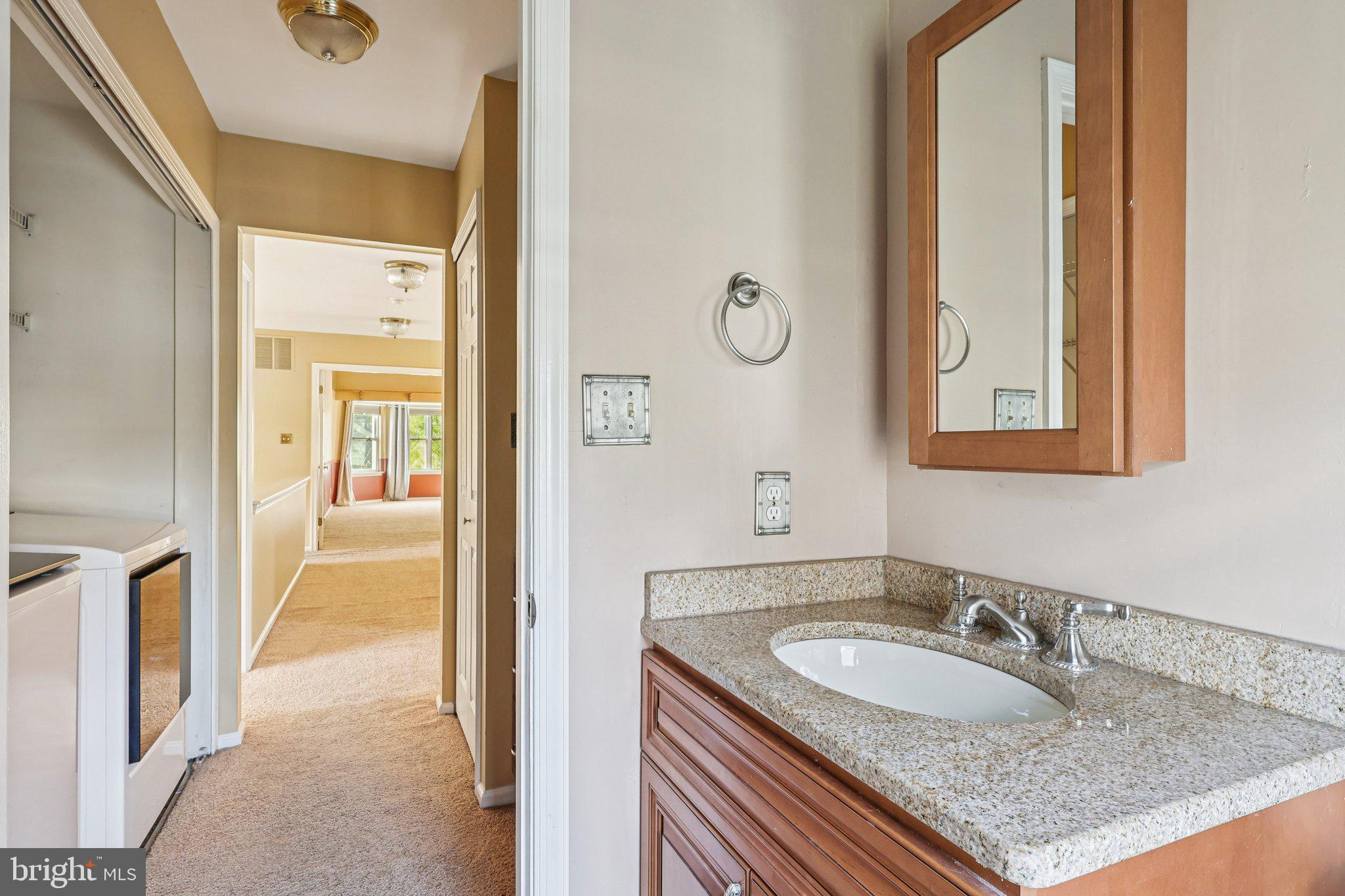 22 Hawk Lane Marlton, NJ 08053 - Photo 32 of 46 a en suite bathroom with a granite countertop sink and a mirror