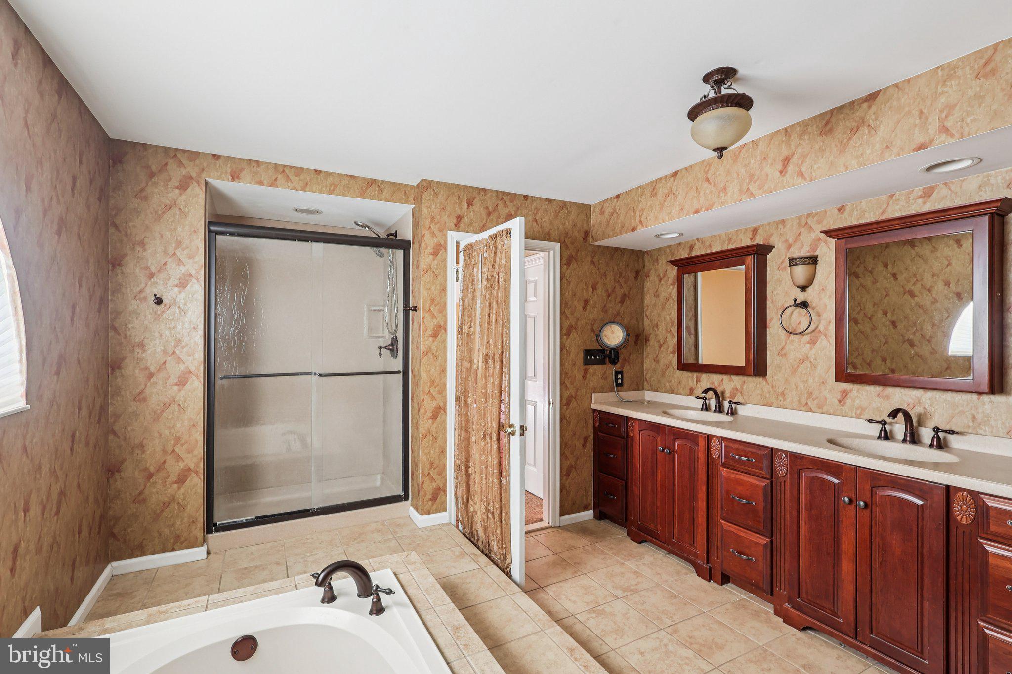 22 Hawk Lane Marlton, NJ 08053 - Photo 38 of 46 a spacious bathroom with a double vanity sink a mirror and shower