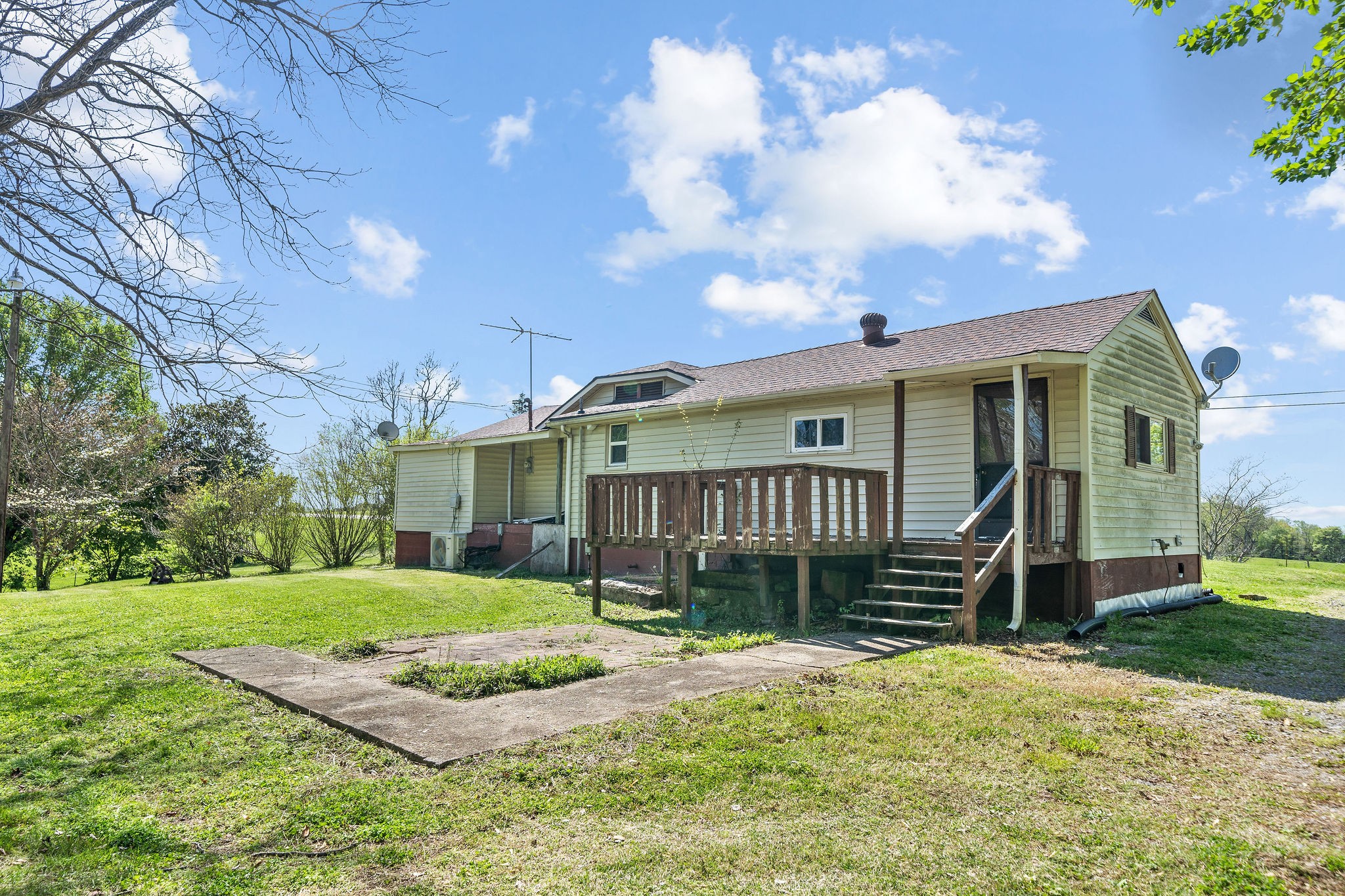 2418 Lock B Road North Clarksville, TN 37043 - Photo 26 of 30 a view of a white house with a yard and plants
