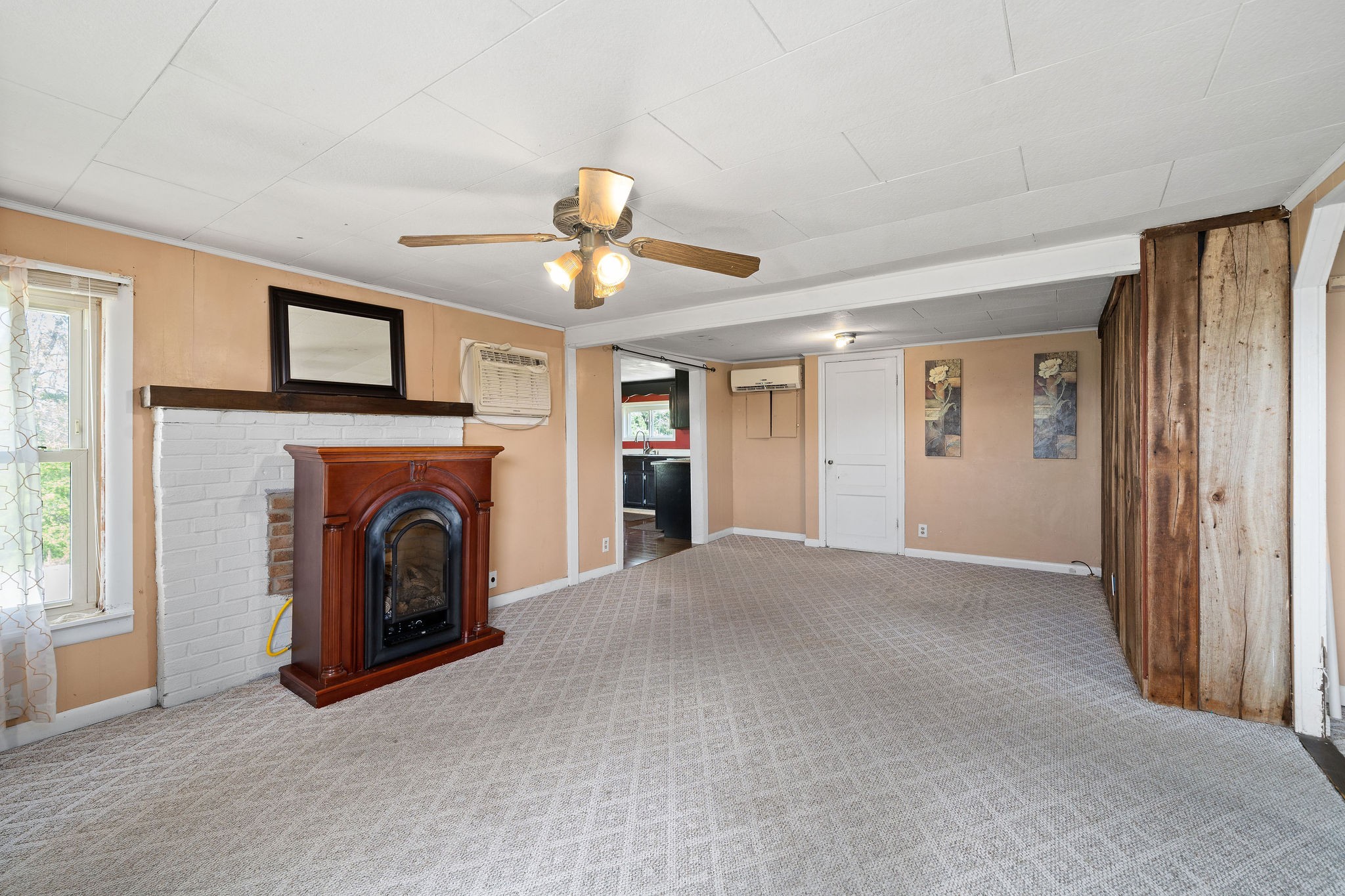 2418 Lock B Road North Clarksville, TN 37043 - Photo 6 of 30 a view of an empty room with window and fireplace