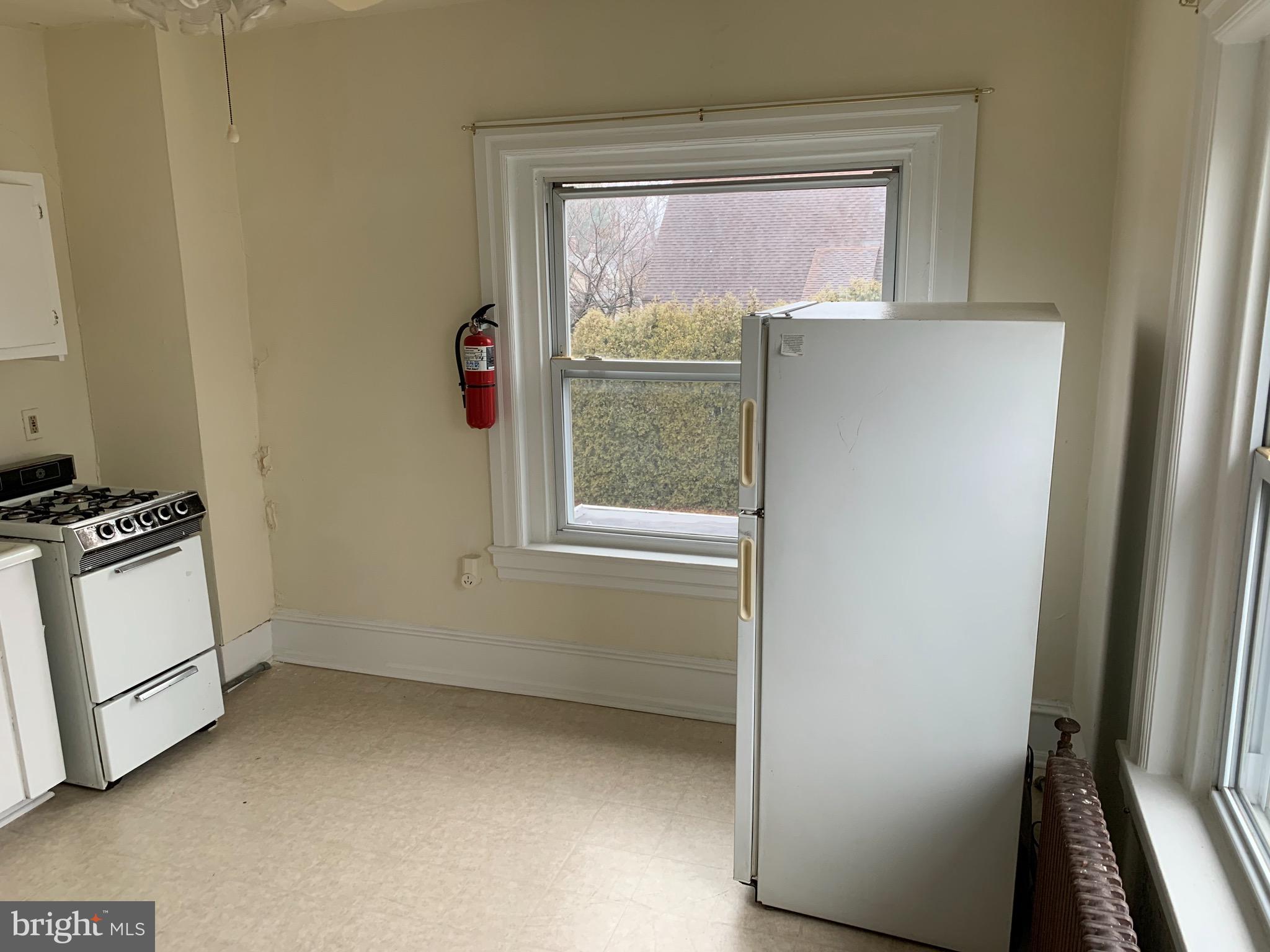 800 Darby Road, Unit 2A Havertown, PA 19083 - Photo 4 of 8 a view of room with window and refrigerator