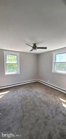 an empty room with a empty space and a window