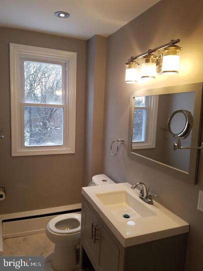 6321 East Fariston Drive Philadelphia, PA 19120 - Photo 27 of 31 a bathroom with a sink mirror and toilet