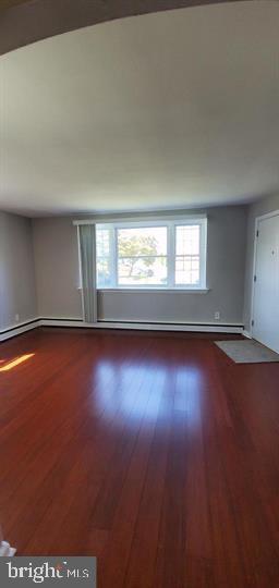 6321 East Fariston Drive Philadelphia, PA 19120 - Photo 28 of 31 an empty room with wooden floor and windows
