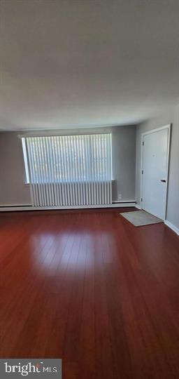 6321 East Fariston Drive Philadelphia, PA 19120 - Photo 29 of 31 an empty room with wooden floor and windows