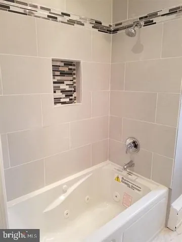 a bathroom with a bath tub