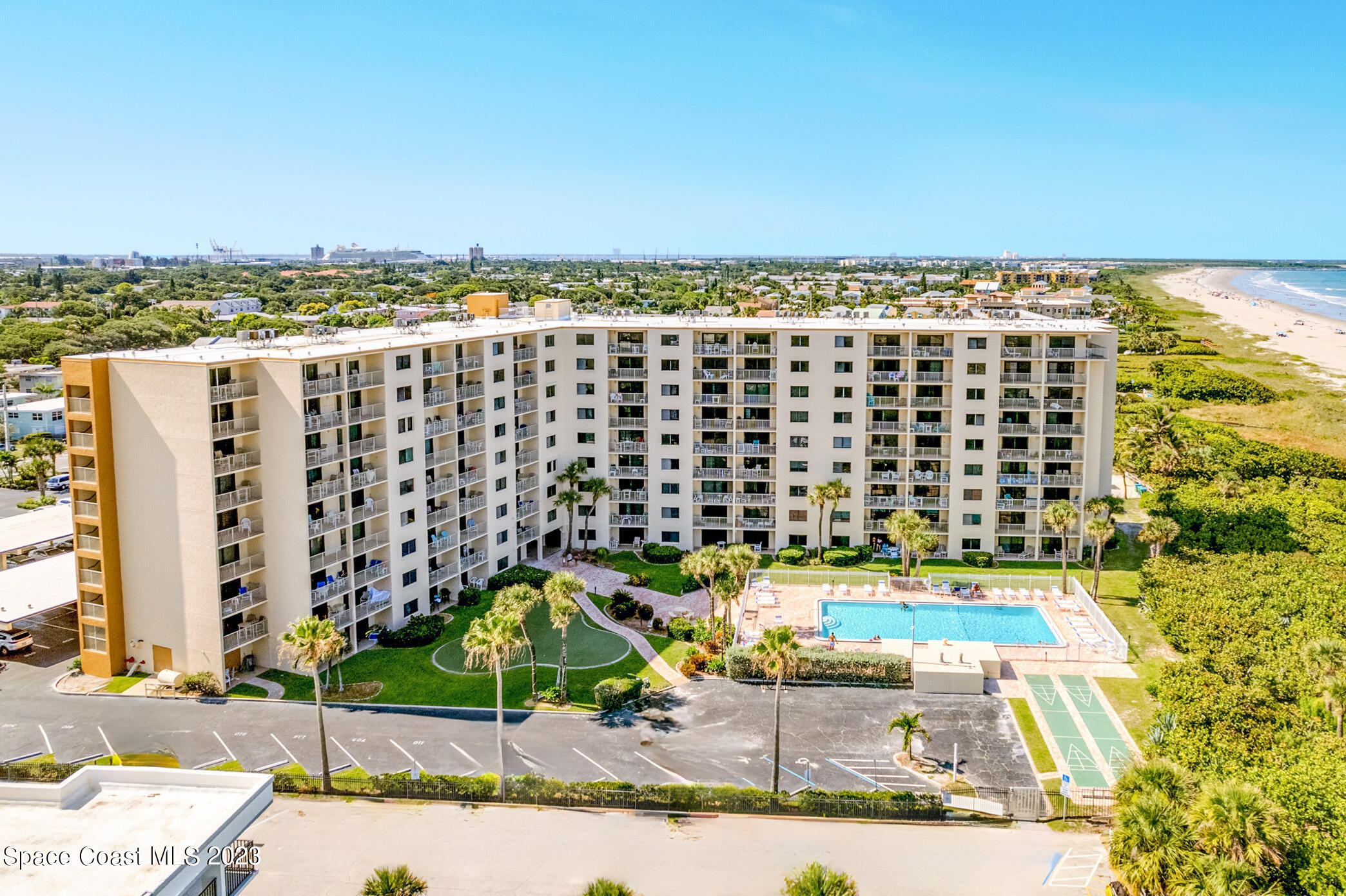 7520 Ridgewood Avenue, Unit 104 Cape Canaveral, FL 32920 - Photo 1 of 35 a view of a city with tall buildings