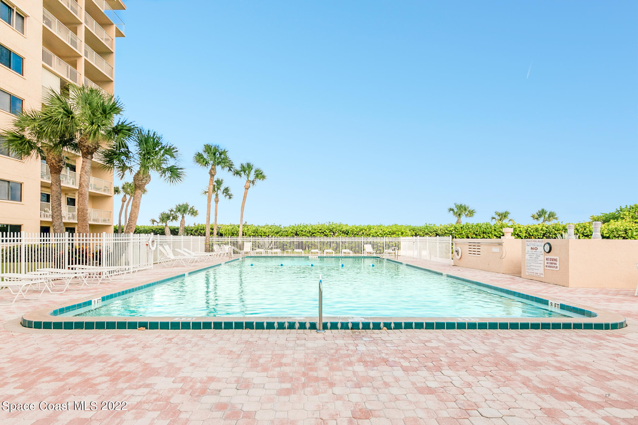 7520 Ridgewood Avenue, Unit 104 Cape Canaveral, FL 32920 - Photo 19 of 35 a view of a backyard