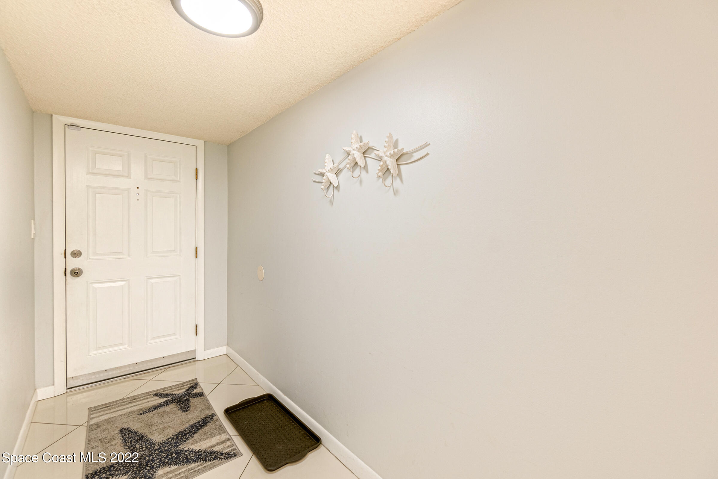 7520 Ridgewood Avenue, Unit 104 Cape Canaveral, FL 32920 - Photo 2 of 35 a view of an empty room