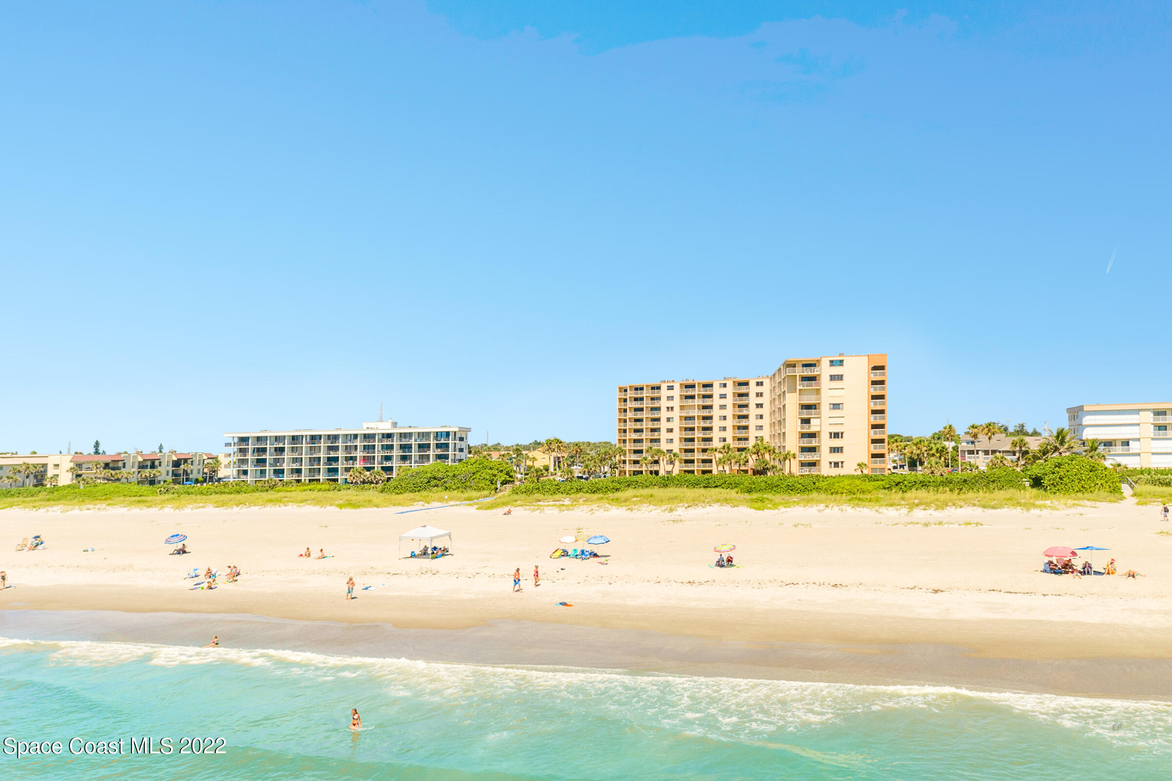 7520 Ridgewood Avenue, Unit 104 Cape Canaveral, FL 32920 - Photo 29 of 35 a view of an ocean and beach