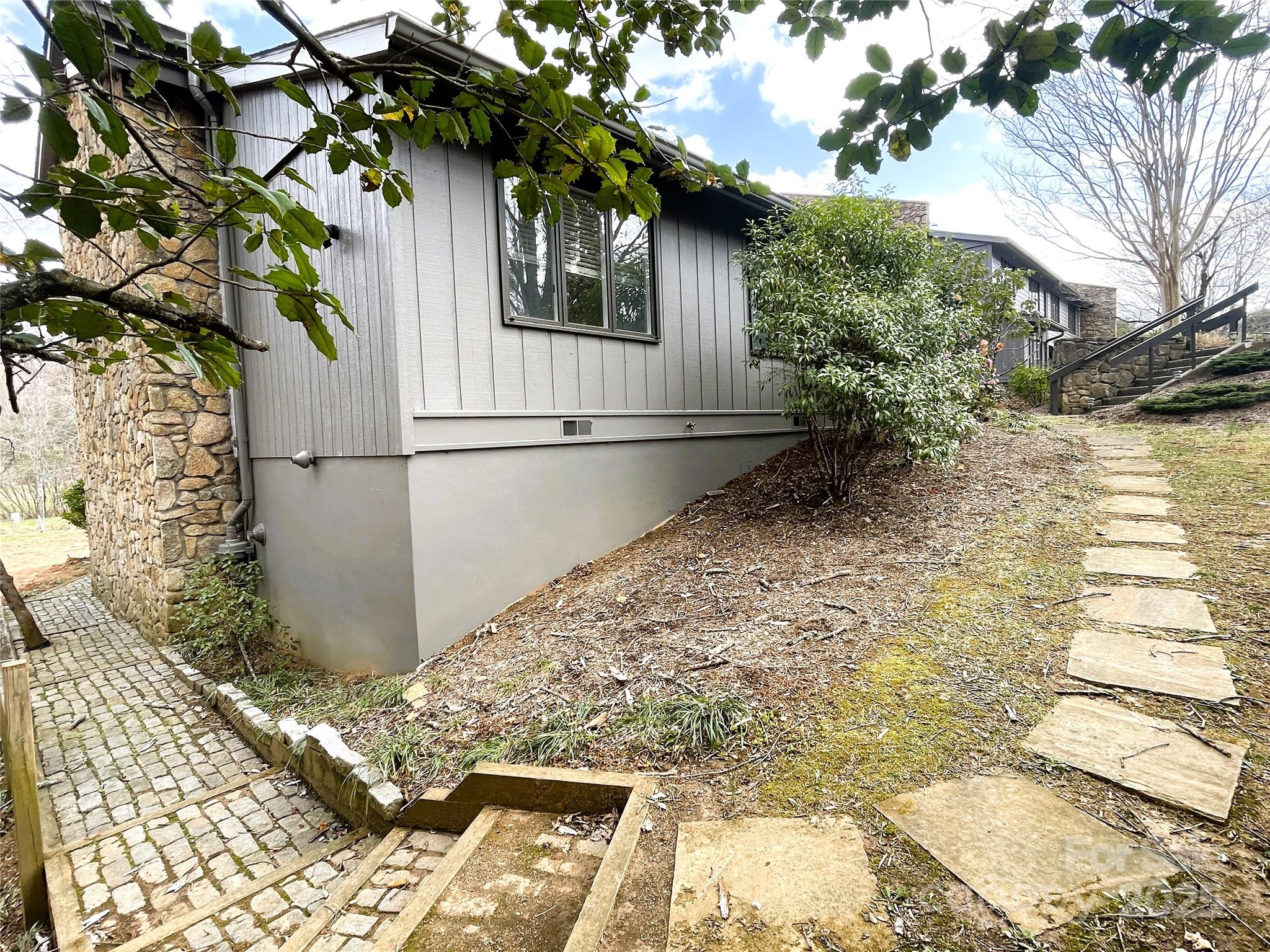 717 Crowfields Lane Asheville, NC 28803 - Photo 2 of 2 a white house with a tree in the background