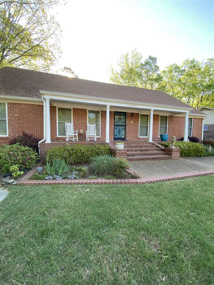 Big Front porch, overlooking the beautifully landscaped front yard, that recently won Yard of the Month for the Walnut Grove Lake HOA, perfect for sitting and watching the world go by. All brick and Vinyl Siding exterior, offers low maintenance.