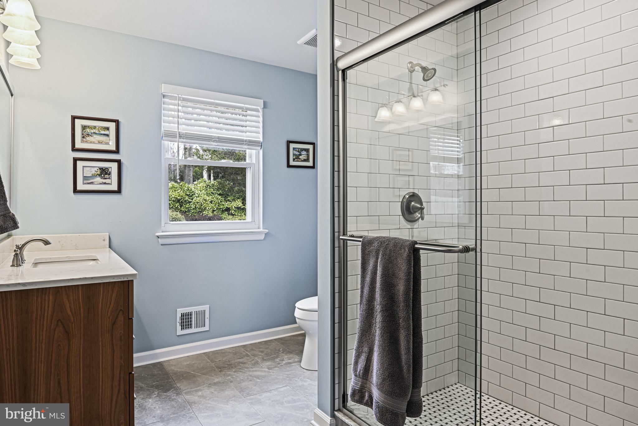1905 Lamson Place McLean, VA 22101 - Photo 12 of 31 a bathroom with a sink and a mirror