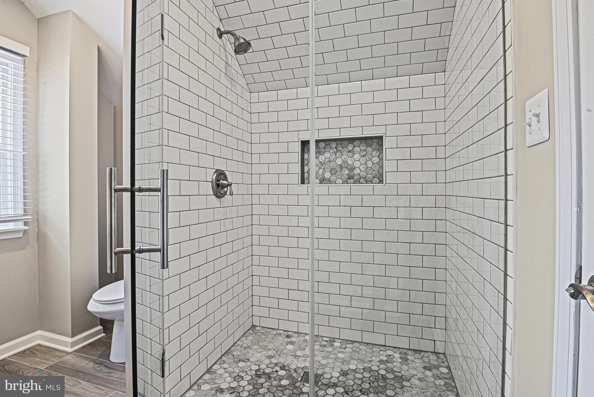 1905 Lamson Place McLean, VA 22101 - Photo 17 of 31 a bathroom with a shower