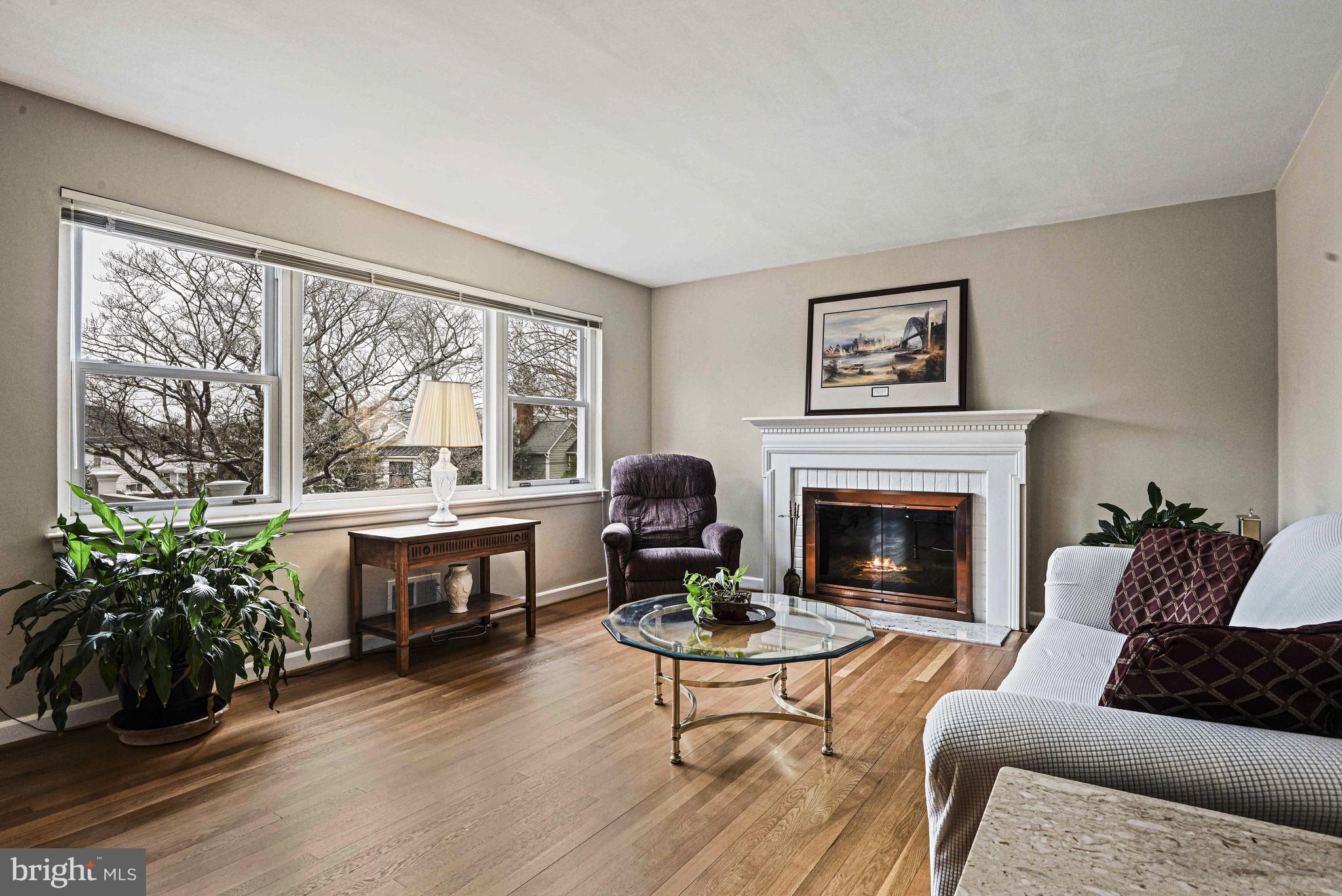 1905 Lamson Place McLean, VA 22101 - Photo 2 of 31 a living room with furniture a fireplace and a large window