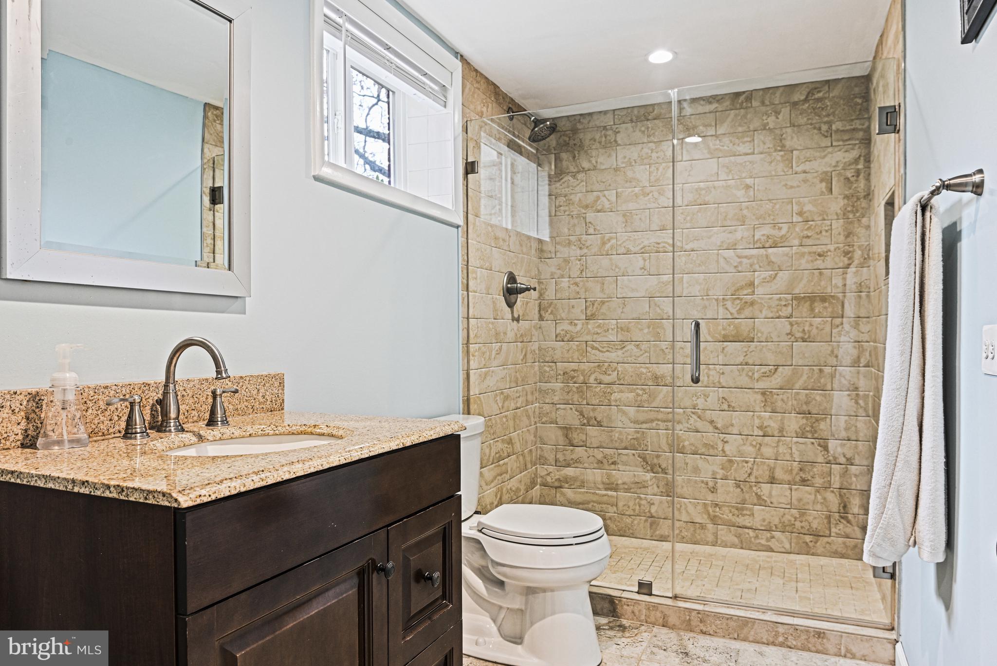 1905 Lamson Place McLean, VA 22101 - Photo 21 of 31 a bathroom with a sink and a mirror