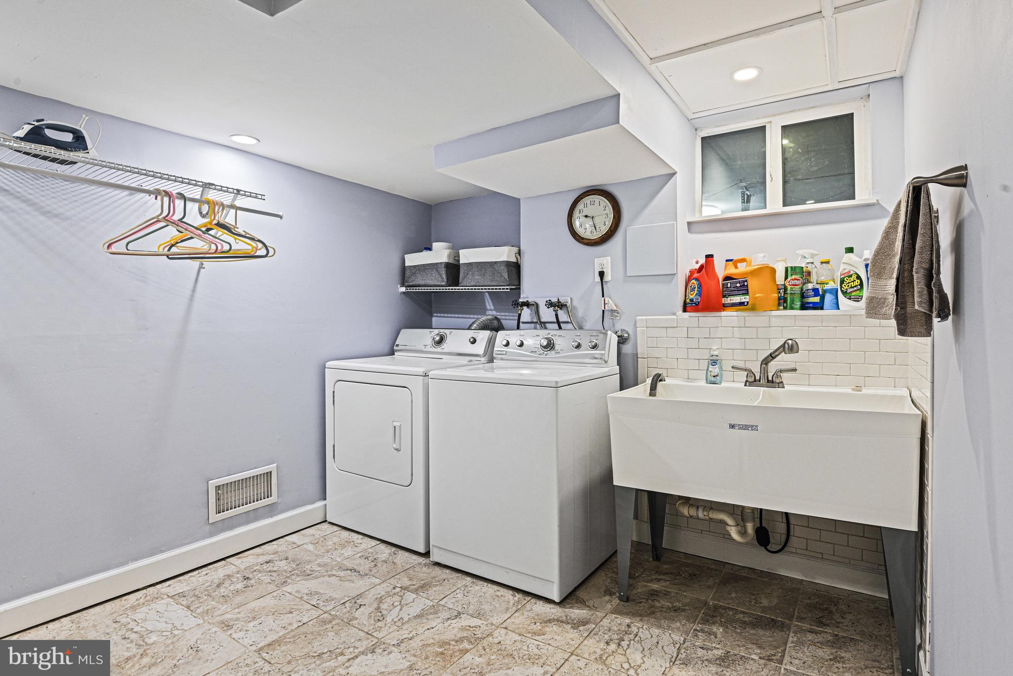 1905 Lamson Place McLean, VA 22101 - Photo 23 of 31 a utility room with a sink a washer and dryer