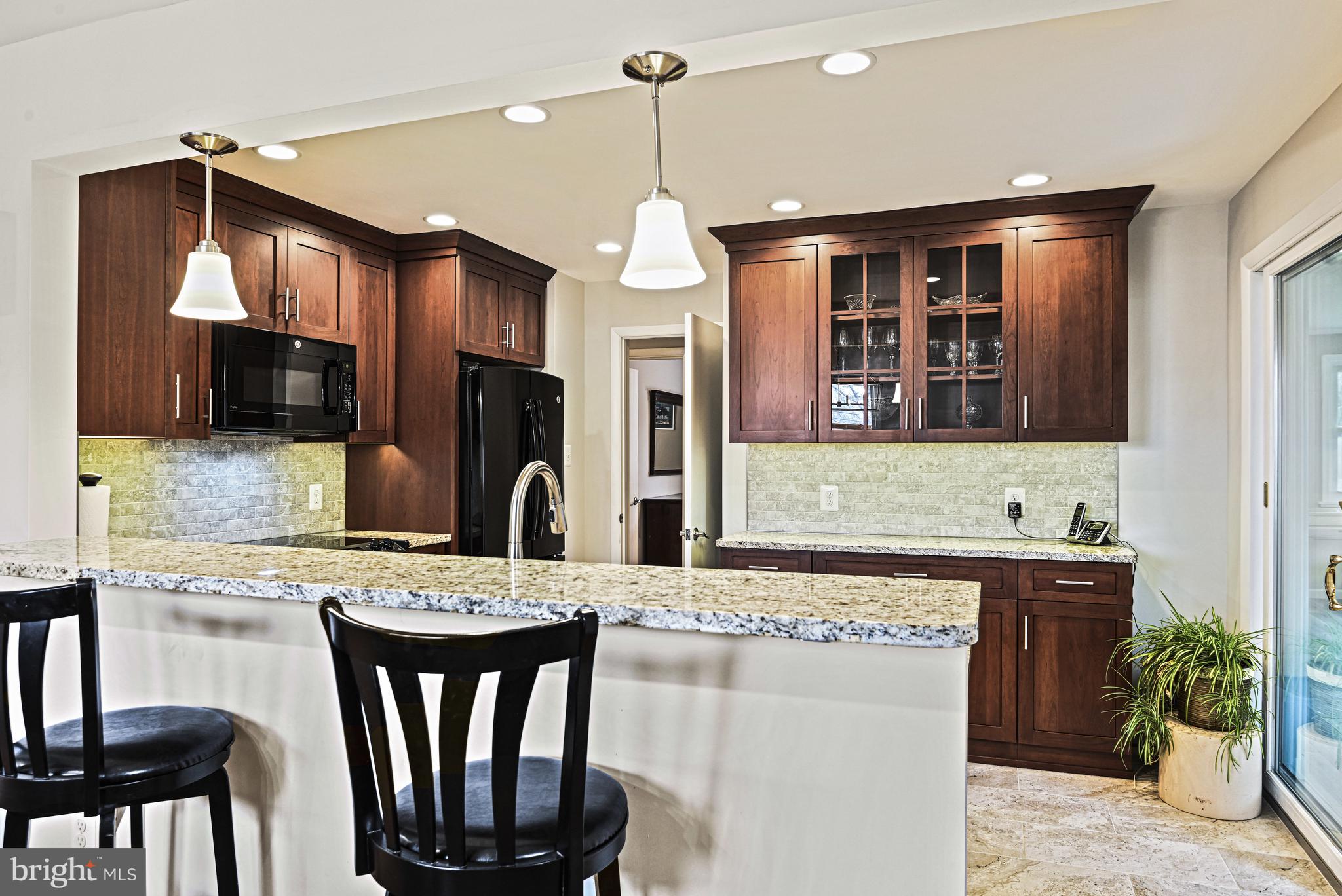 1905 Lamson Place McLean, VA 22101 - Photo 5 of 31 a kitchen with a table and chairs in it