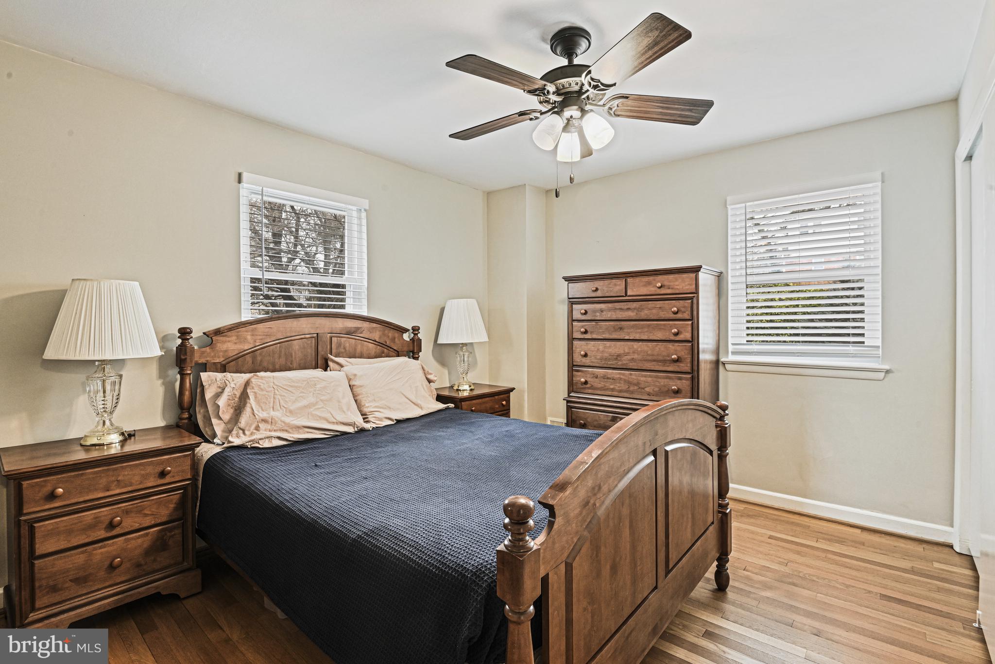 1905 Lamson Place McLean, VA 22101 - Photo 10 of 31 a bedroom with a bed a dresser and a window