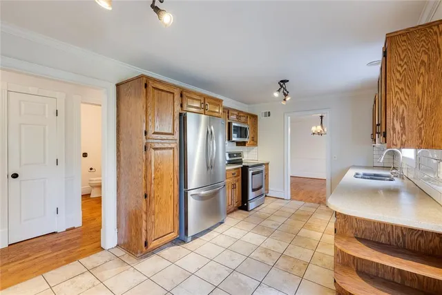 a kitchen with granite countertop a sink and cabinets
