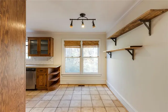 a kitchen with a stove a microwave and a refrigerator