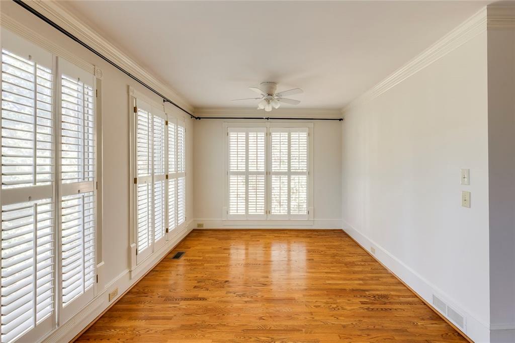 5377 Trentham Drive Dunwoody, GA 30338 - Photo 27 of 51 a view of an empty room with wooden floor and a window