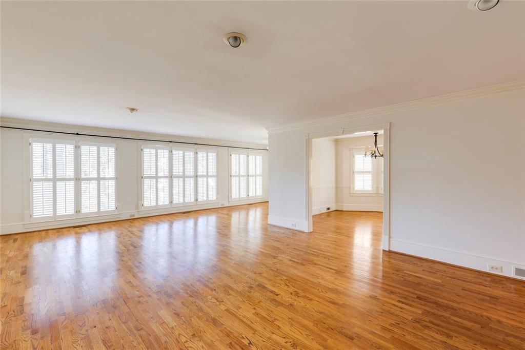 5377 Trentham Drive Dunwoody, GA 30338 - Photo 29 of 51 a view of an empty room with wooden floor and glass door