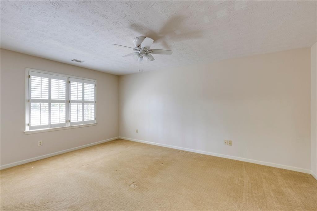 5377 Trentham Drive Dunwoody, GA 30338 - Photo 30 of 51 an empty room with a window