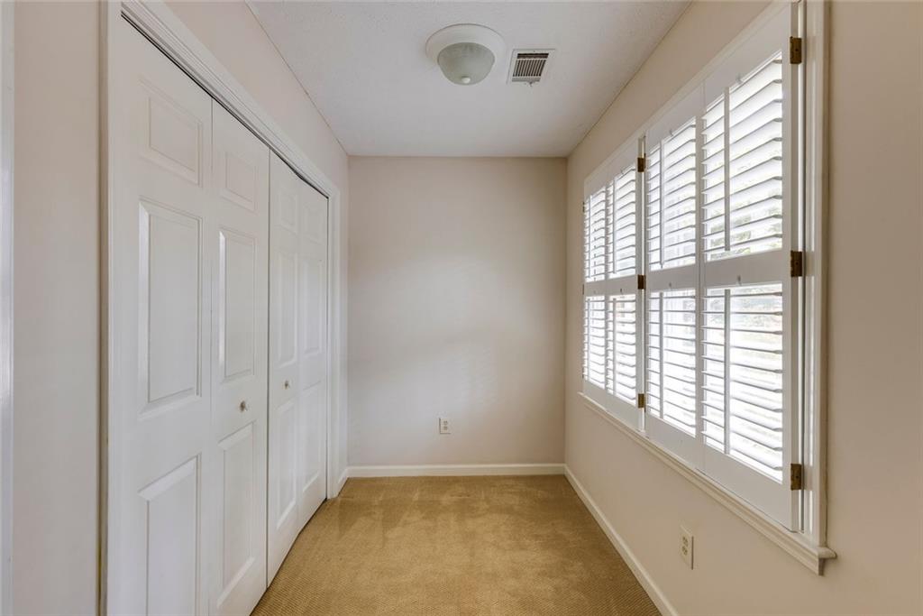 5377 Trentham Drive Dunwoody, GA 30338 - Photo 33 of 51 a view of an empty room with a window