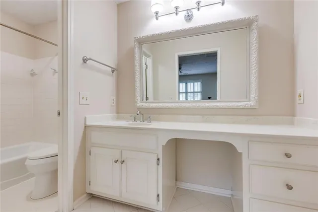 a bathroom with a bathtub and a sink