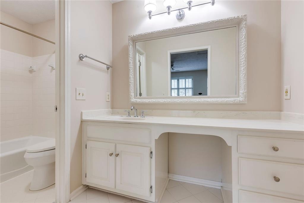 5377 Trentham Drive Dunwoody, GA 30338 - Photo 34 of 51 a bathroom with a sink and a mirror