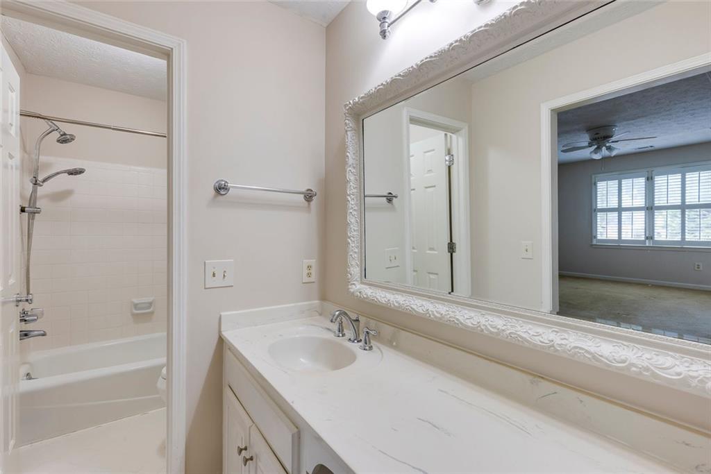 5377 Trentham Drive Dunwoody, GA 30338 - Photo 35 of 51 a bathroom with a bathtub and a sink