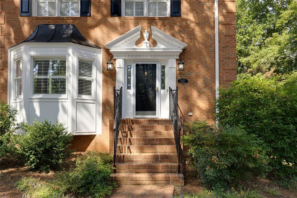 5377 Trentham Drive Dunwoody, GA 30338 - Photo 4 of 51 front view of a house with a small yard