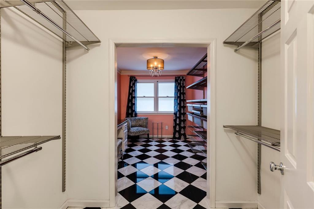 5377 Trentham Drive Dunwoody, GA 30338 - Photo 42 of 51 a bathroom with a black and white checkered floor