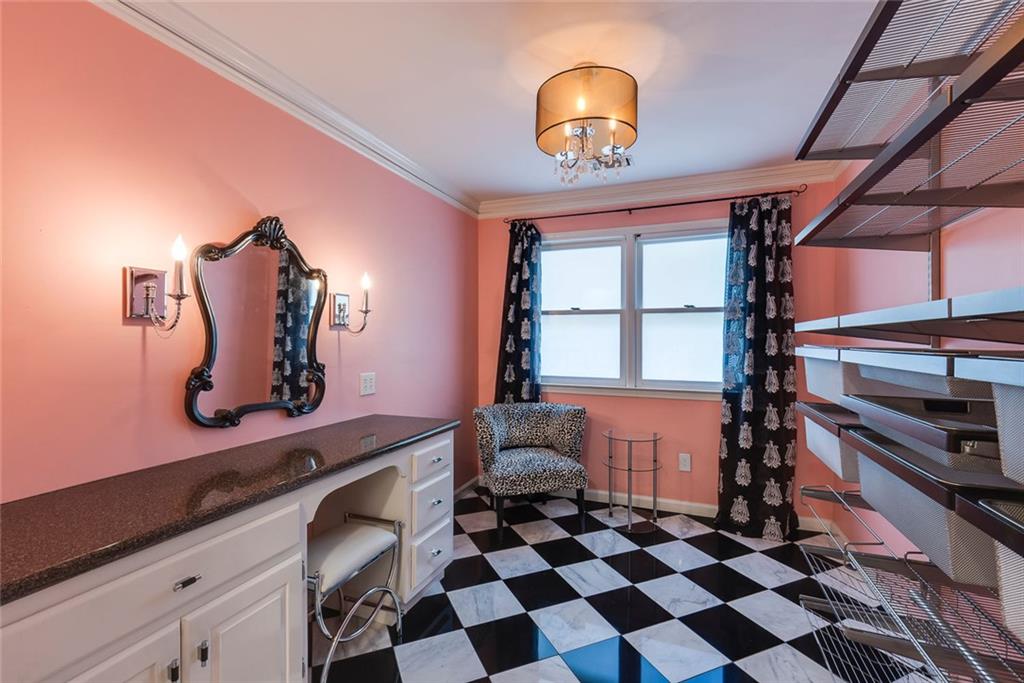 5377 Trentham Drive Dunwoody, GA 30338 - Photo 43 of 51 a room with a large window and chandelier