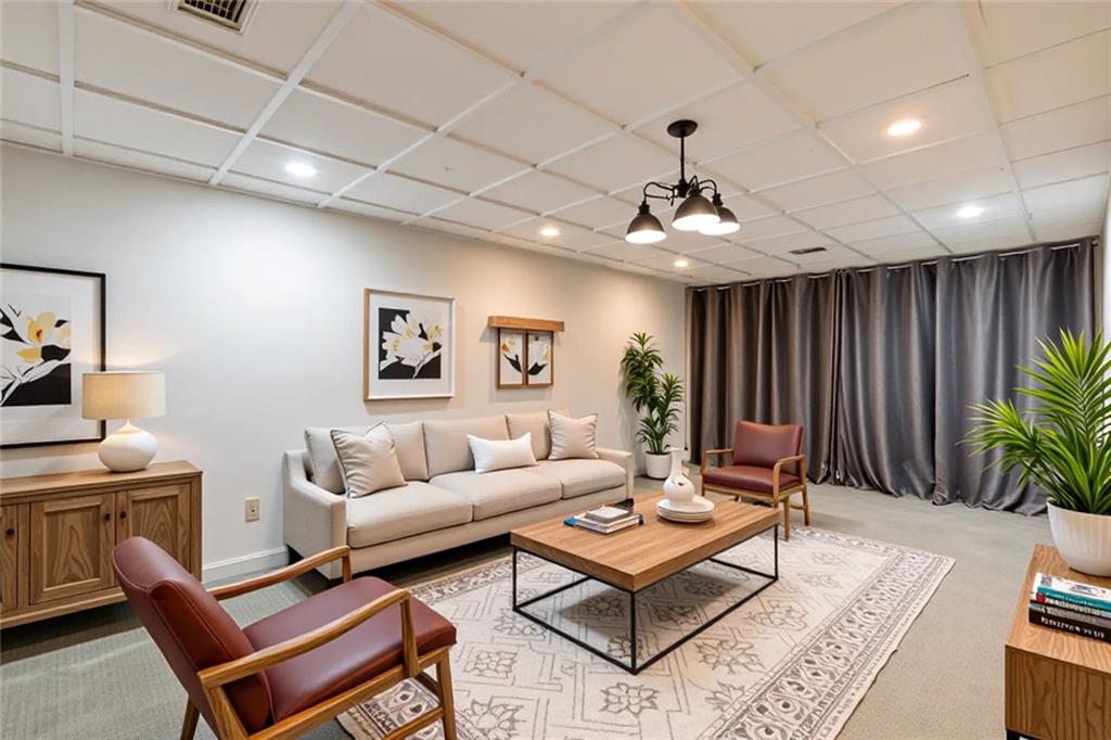 5377 Trentham Drive Dunwoody, GA 30338 - Photo 45 of 51 a living room with furniture a rug and a chandelier