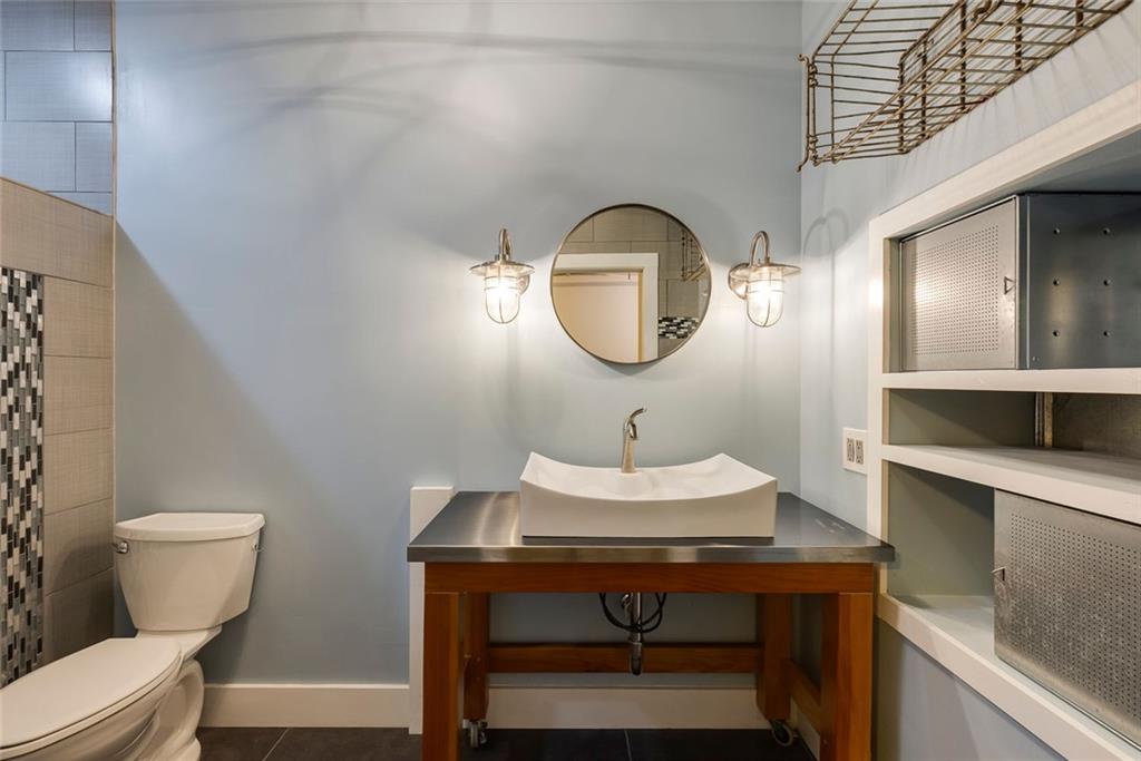 5377 Trentham Drive Dunwoody, GA 30338 - Photo 46 of 51 a bathroom with a sink toilet and a mirror