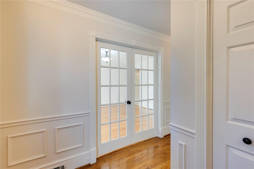 5377 Trentham Drive Dunwoody, GA 30338 - Photo 8 of 51 a view of an empty room with cabinet and floor to ceiling window