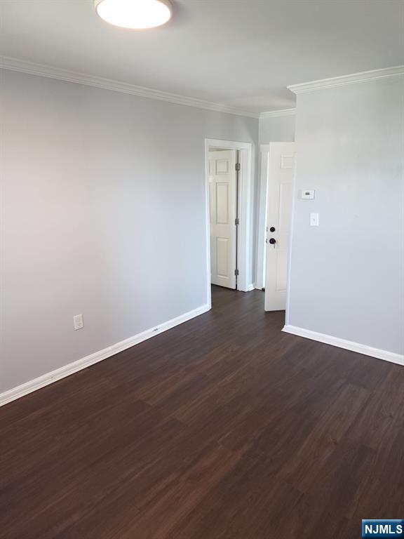 21 Ave D, Unit 2 Lodi, NJ 07644 - Photo 7 of 7 a view of an empty room with wooden floor