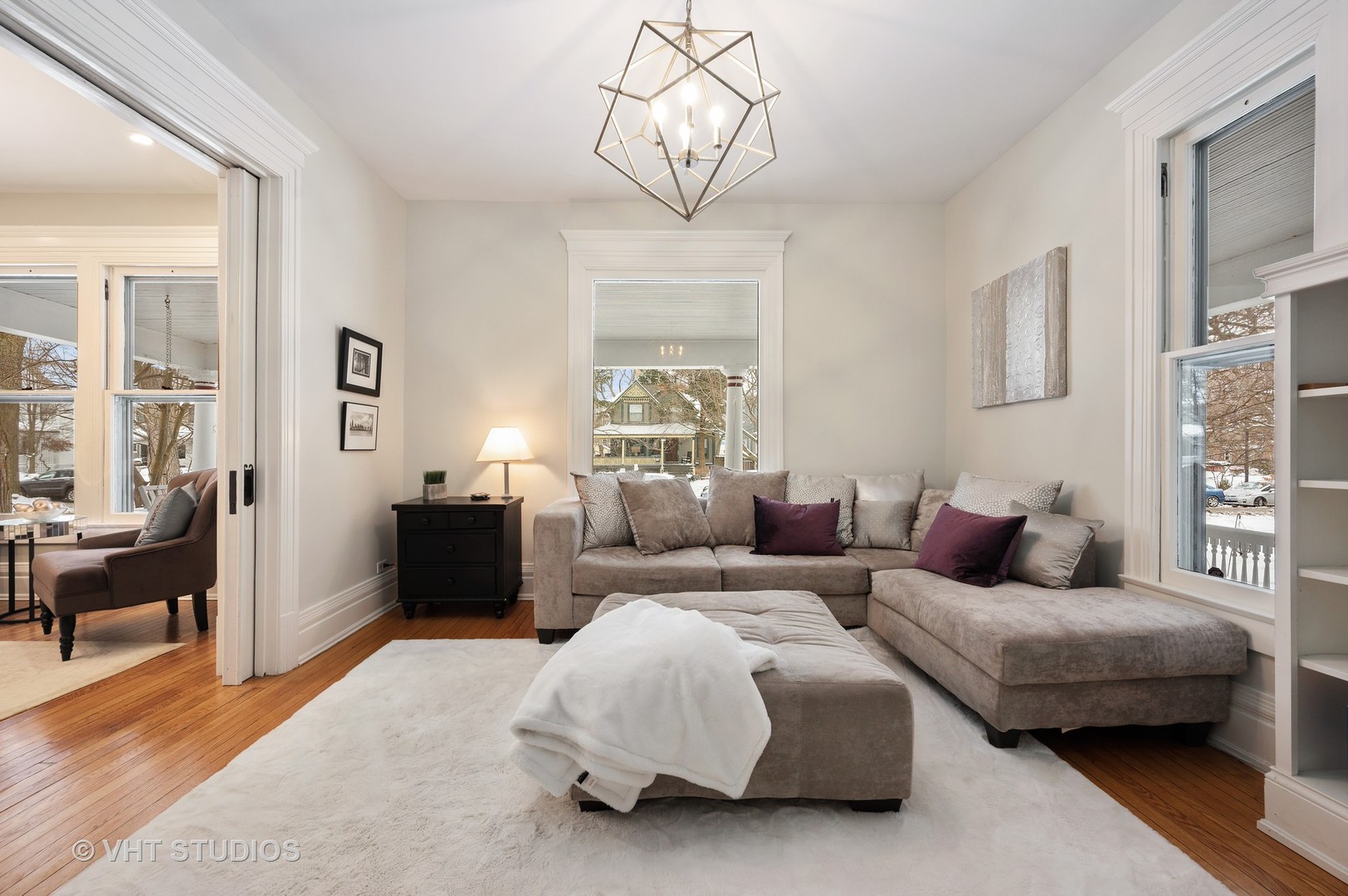 1031 Maple Avenue Evanston, IL 60202 - Photo 12 of 54 a living room with furniture and a chandelier