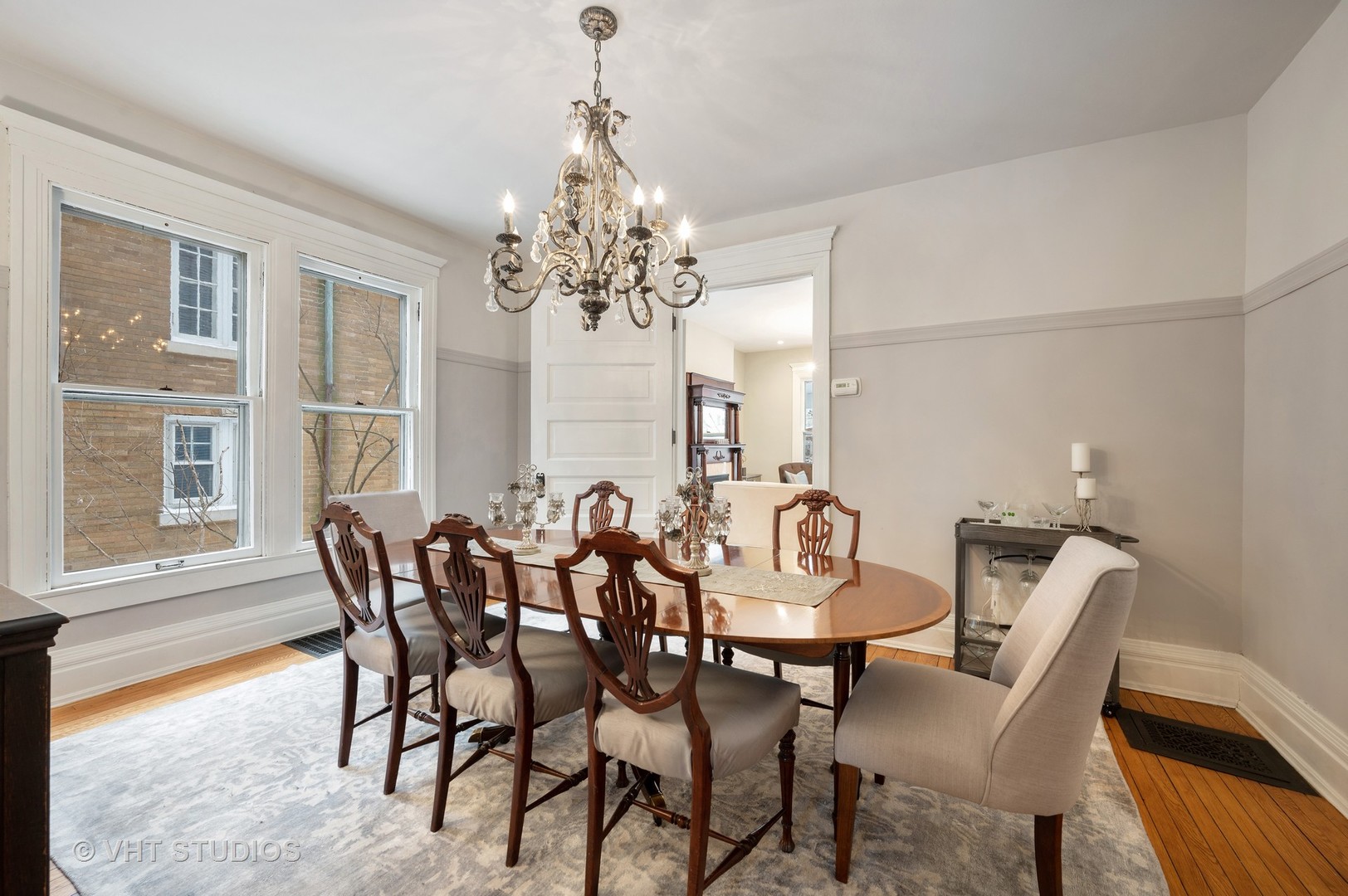 1031 Maple Avenue Evanston, IL 60202 - Photo 13 of 54 a view of a dining room with furniture and chandelier