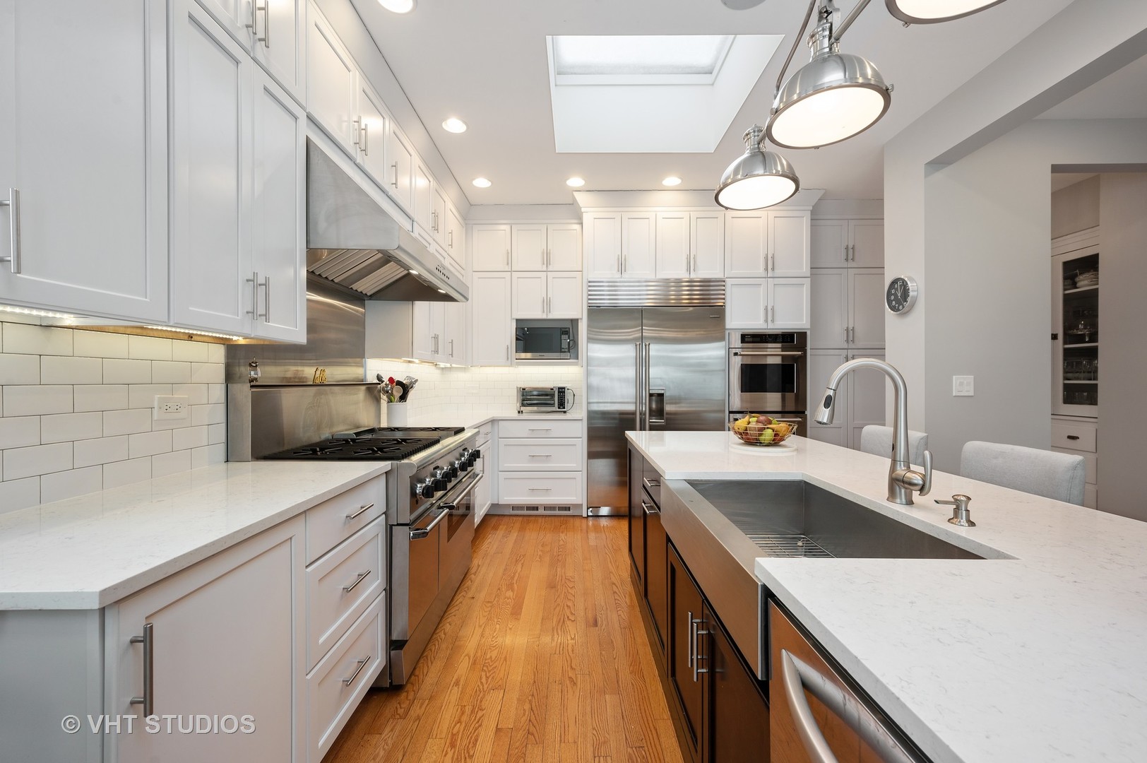 1031 Maple Avenue Evanston, IL 60202 - Photo 16 of 54 a kitchen with a sink a stove top oven a counter space and cabinets