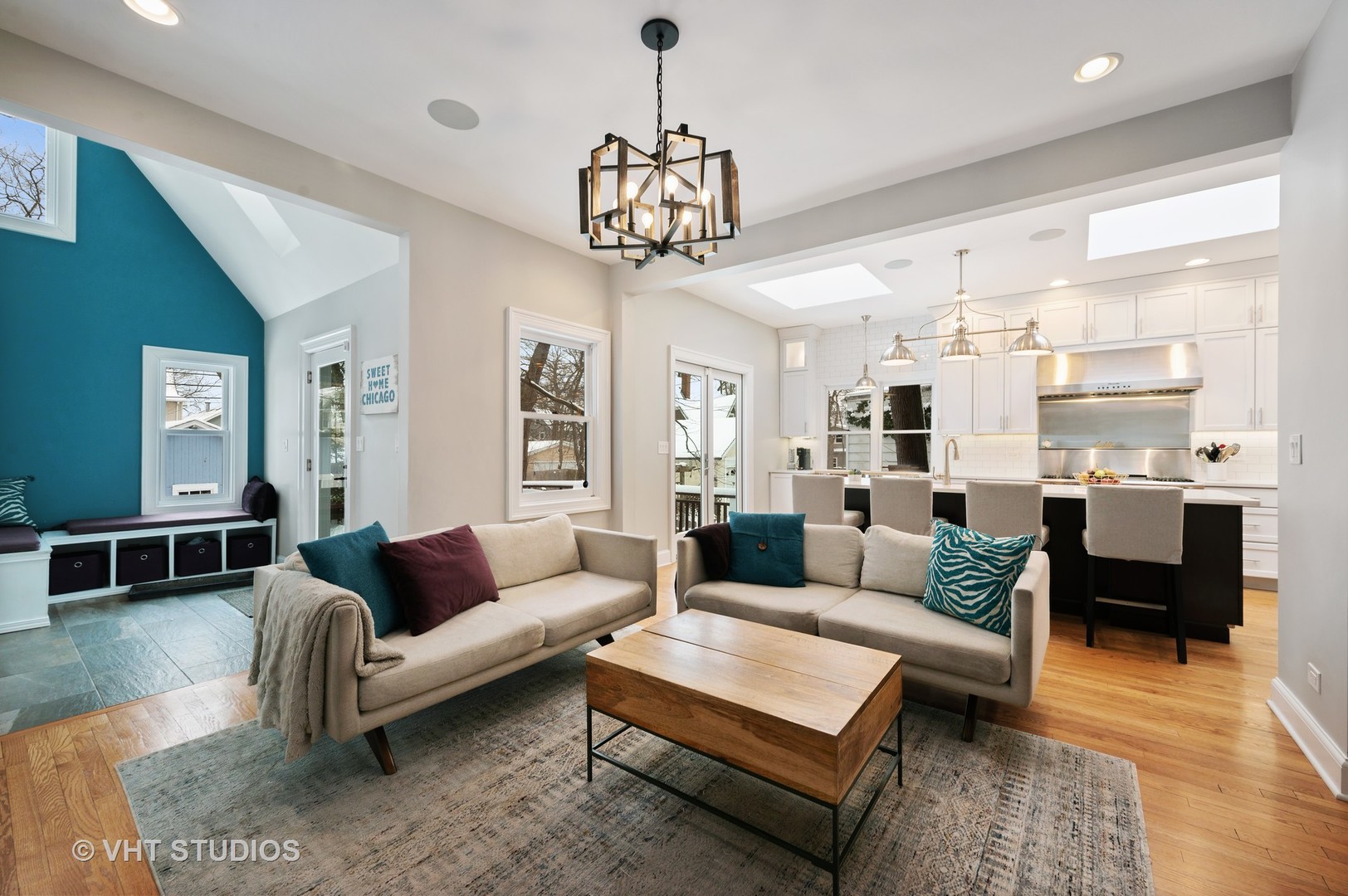 1031 Maple Avenue Evanston, IL 60202 - Photo 18 of 54 a living room with furniture kitchen view and a chandelier